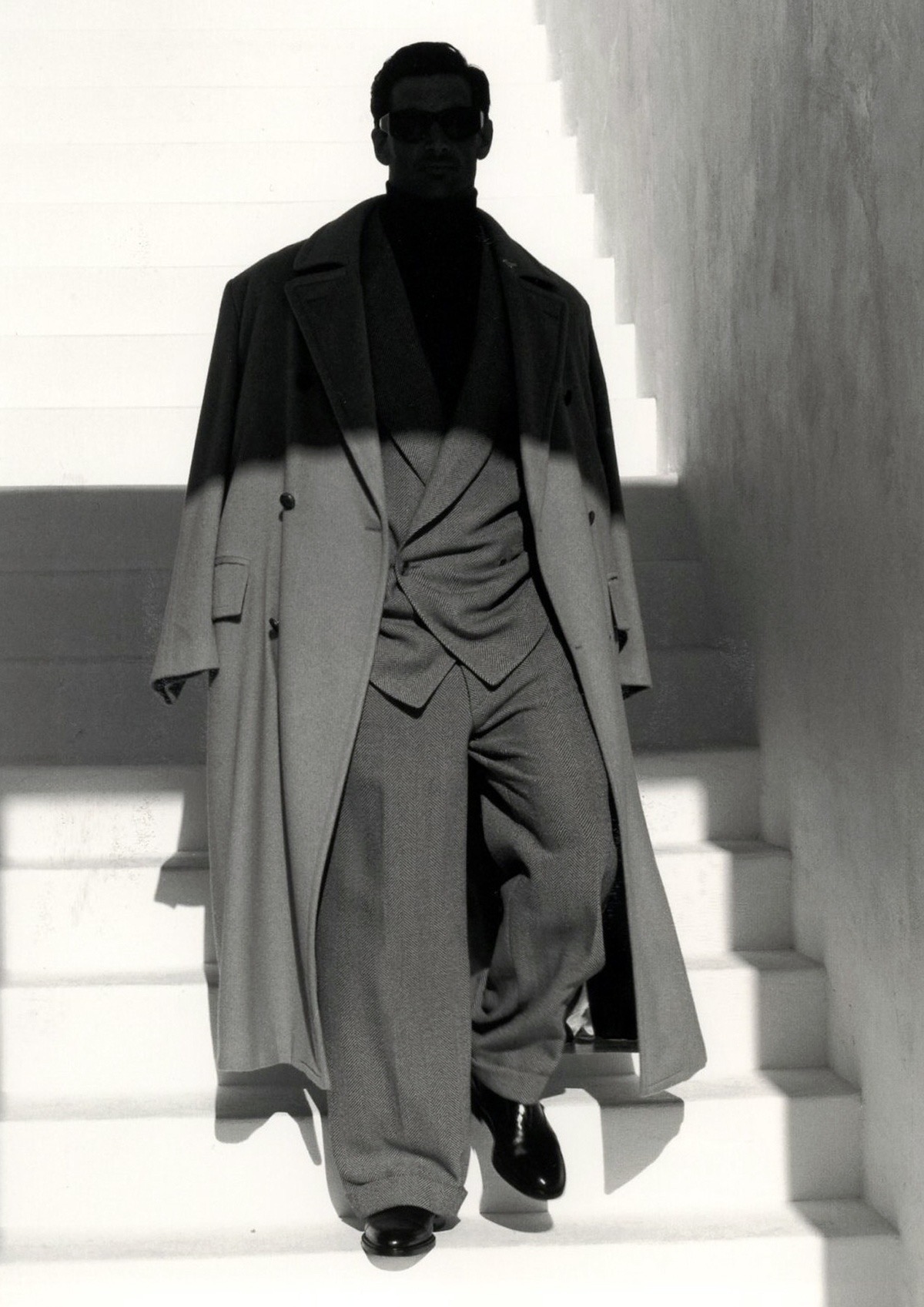 Editorial silhouette of a man in a tailored coat